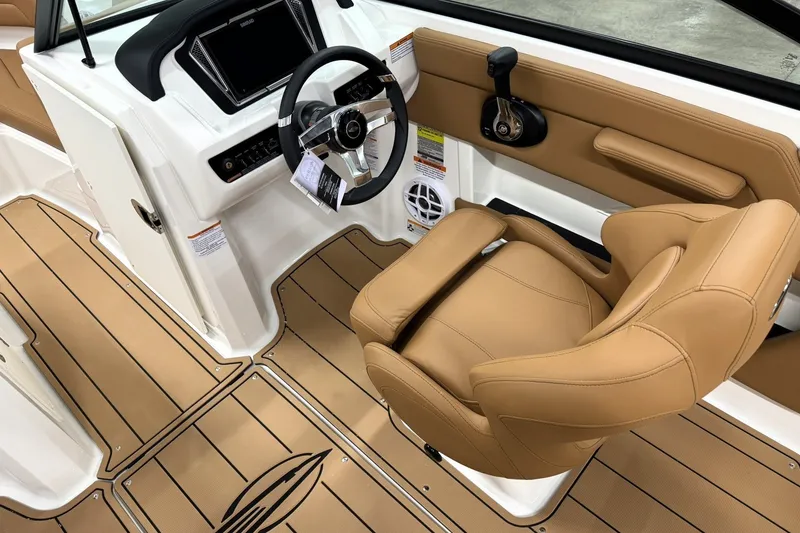 Slide: The Image of Interior of 2027 Chaparral 21 SSi boat with tan seating and modern dashboard. - 11