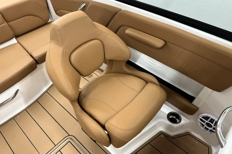Slide: The Image of 2027 Chaparral 21 SSi boat interior with tan leather seating and modern design. - 16