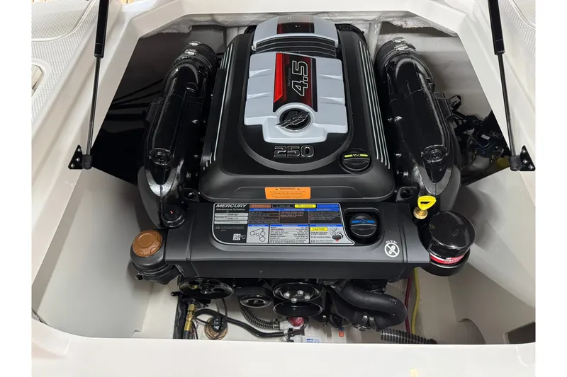 Slide: The Image of Engine compartment of 2027 Chaparral 21 SSi boat, featuring a Mercury 4.5L engine. - 21