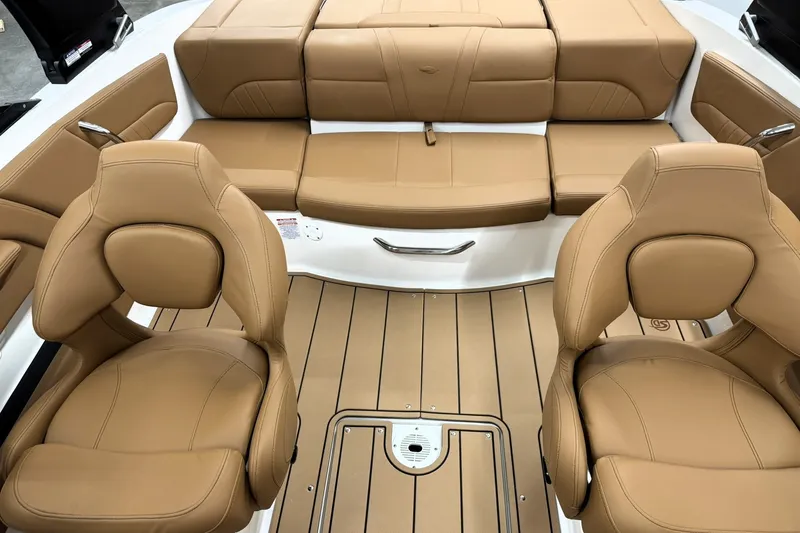 Slide: The Image of 2027 Chaparral 21 SSi boat interior with tan leather seats and sleek design. - 17
