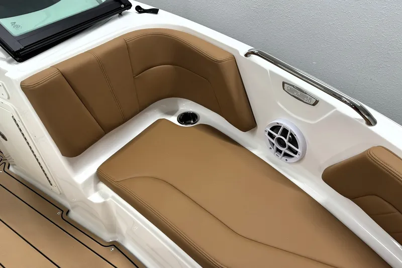 Slide: The Image of 2027 Chaparral 21 SSi boat interior with tan seating and speaker system. - 26