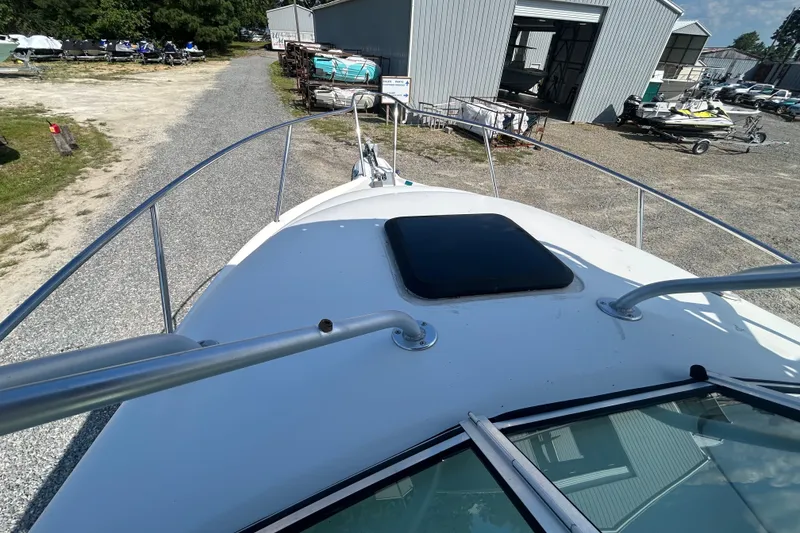 Slide: The Image of 2006 Sailfish 234 WAC boat deck view at a storage facility. - 22