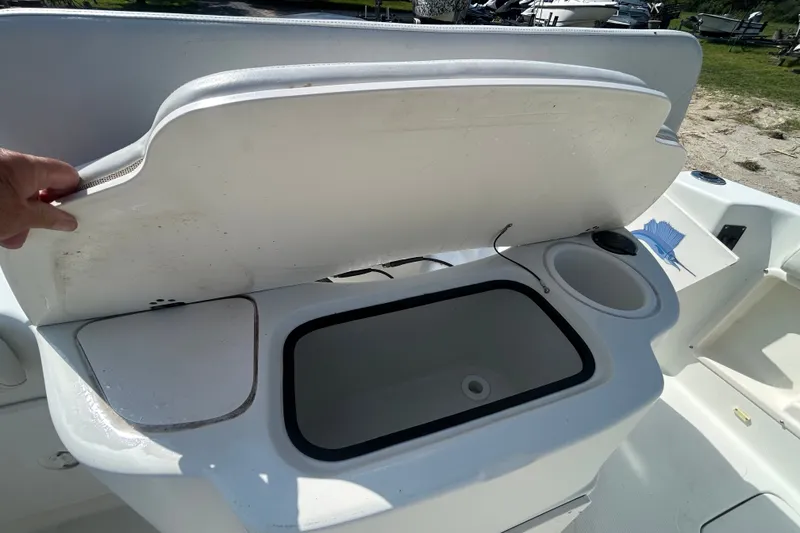 Slide: The Image of Open storage compartment on a 2006 Sailfish 234 WAC boat. - 25