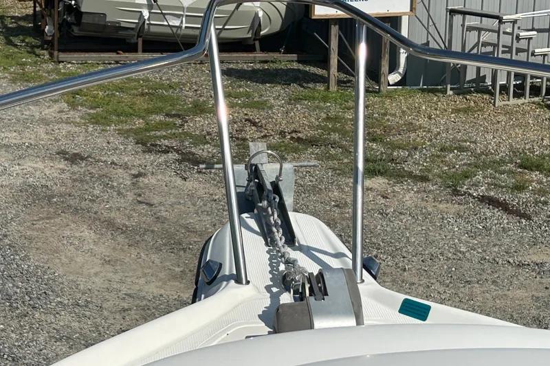 Slide: The Image of Bow view of 2006 Sailfish 234 WAC boat with anchor chain and railing. - 23
