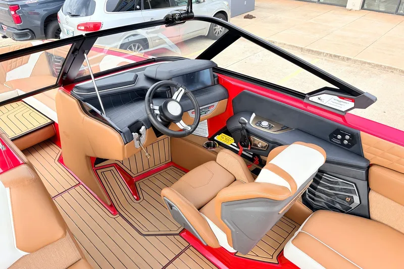 Slide: The Image of Interior of 2022 Nautique Super Air Nautique G25 boat with tan and red accents. - 37