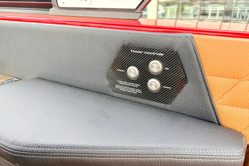 Slide: The Image of 2022 Nautique Super Air Nautique G25 tower controls on leather interior panel. - 42
