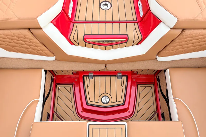 Slide: The Image of 2022 Nautique Super Air Nautique G25 interior with tan and red accents. - 31