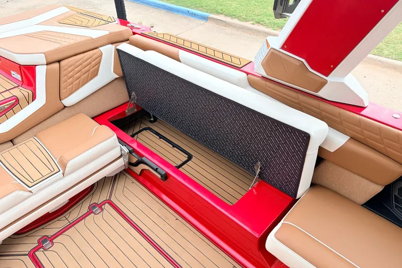 Slide: The Image of 2022 Nautique Super Air Nautique G25 interior with open storage compartment. - 26