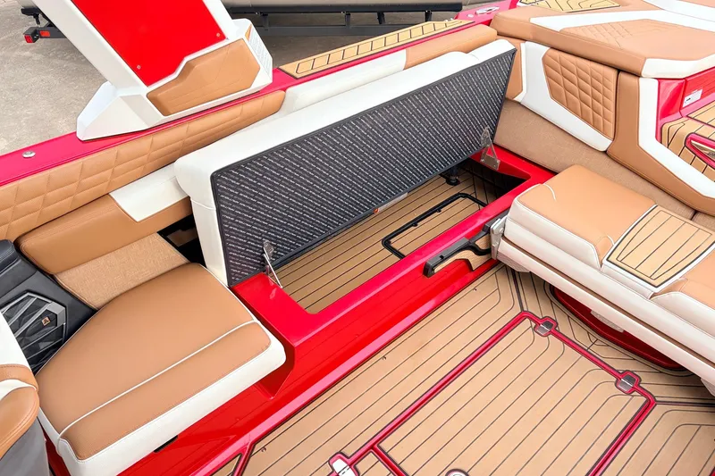 Slide: The Image of 2022 Nautique Super Air Nautique G25 interior with open storage compartment. - 34