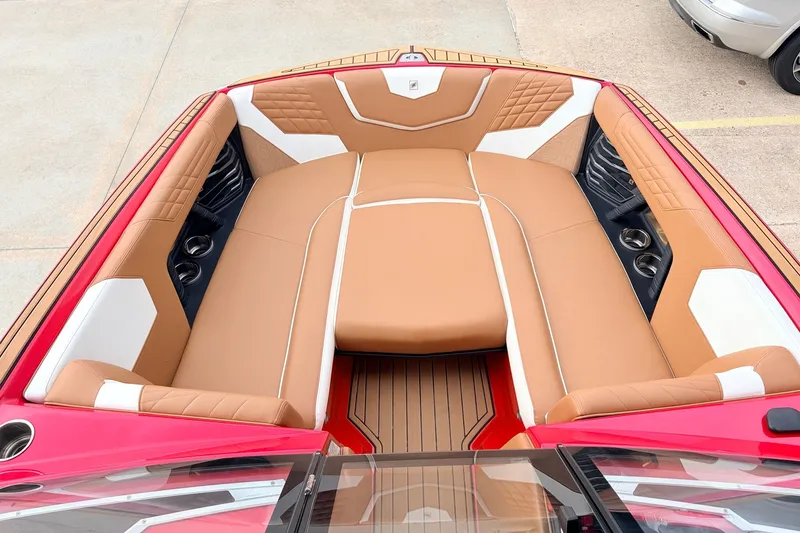 Slide: The Image of 2022 Nautique Super Air Nautique G25 boat interior with tan and white seating. - 11