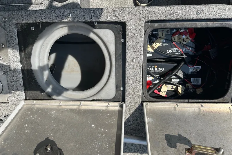 Slide: The Image of Bass Tracker Pro 16 boat compartments with battery storage, 2021 model. - 31
