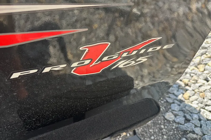 Slide: The Image of Bass Tracker Pro 16 boat, 2021 model, featuring Pro Guide V165 logo. - 37