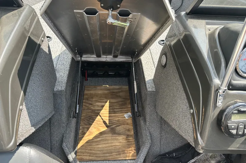 Slide: The Image of Bass Tracker Pro 16 boat storage compartment, 2021 model, open with visible interior details. - 19