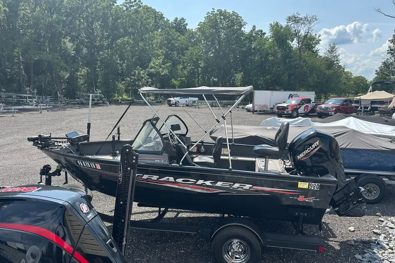 Slide: The Image of 2021 Bass Tracker Pro 16 boat with Mercury engine in outdoor lot. - 36