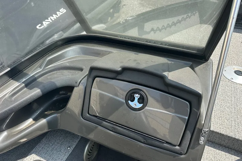 Slide: The Image of 2021 Bass Tracker Pro 16 dashboard with storage compartment and windshield. - 21
