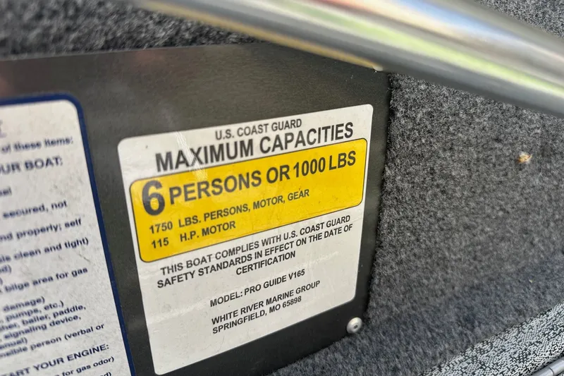 Slide: The Image of Bass Tracker Pro 16 boat capacity label, 6 persons or 1000 lbs, 115 HP motor, 2021 model. - 25
