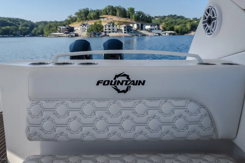 Slide: The Image of Luxury seating on a 2026 Fountain 39 DX boat with scenic lake view. - 60