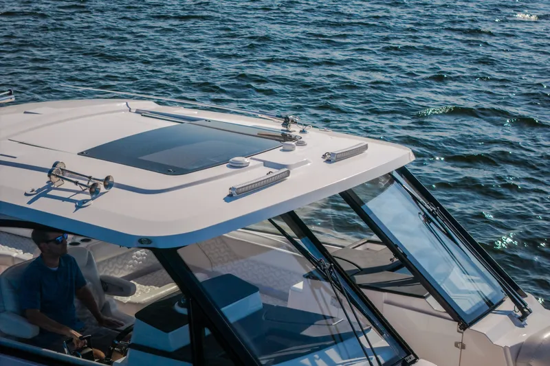 Slide: The Image of 2026 Fountain 39 DX boat cruising on open water, featuring sleek design and modern amenities. - 15