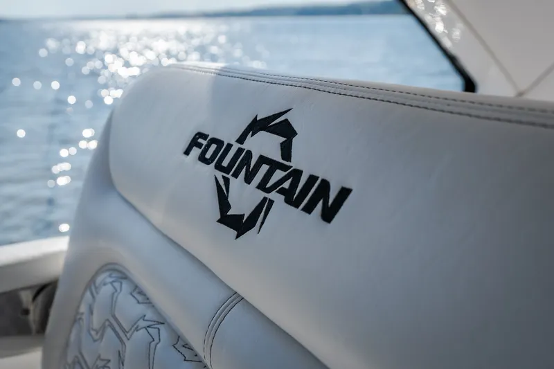 Slide: The Image of 2026 Fountain 39 DX boat seat with logo, ocean background. - 32