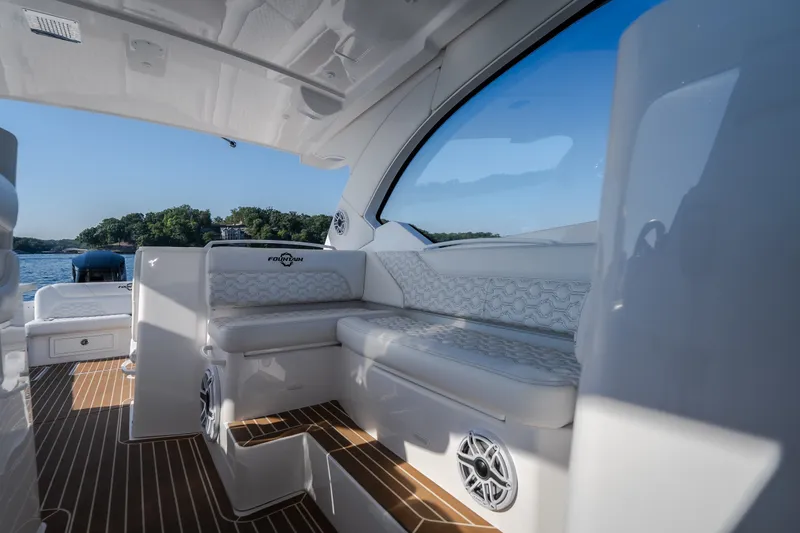 Slide: The Image of Luxurious interior of 2026 Fountain 39 DX boat with elegant seating and scenic water view. - 51