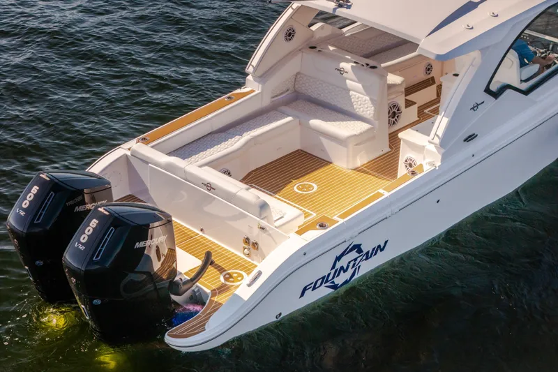 Slide: The Image of 2026 Fountain 39 DX boat with twin Mercury engines on water. - 13