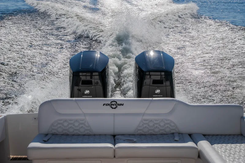 Slide: The Image of 2026 Fountain 39 DX boat with dual Verado engines cruising on water. - 47