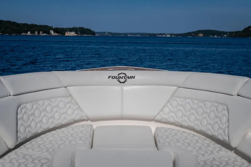 Slide: The Image of Luxury seating on a 2026 Fountain 39 DX boat with scenic water view. - 63