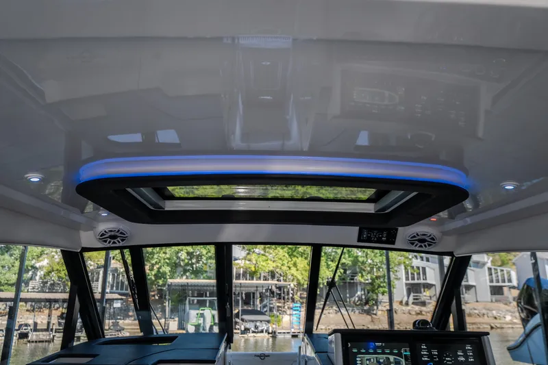 Slide: The Image of Interior view of 2026 Fountain 39 DX boat with modern dashboard and sunroof. - 54