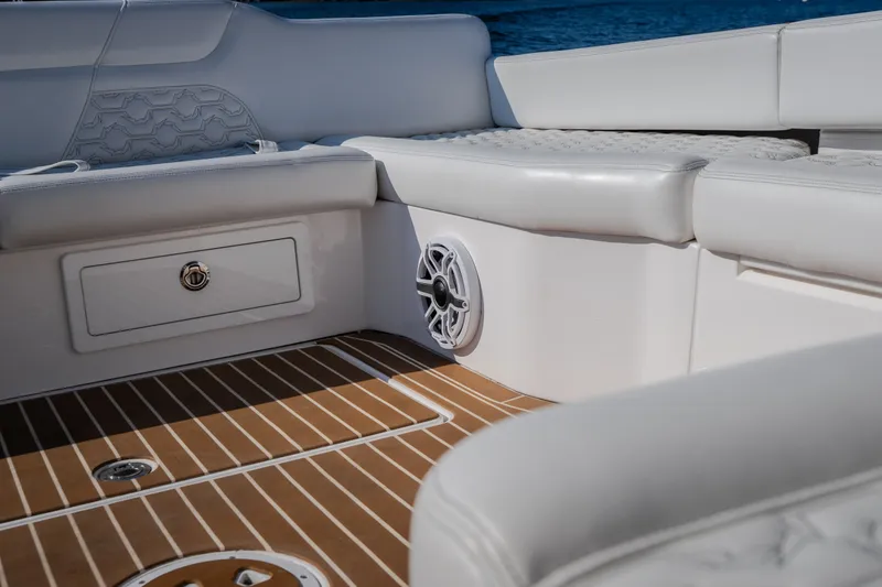 Slide: The Image of Luxurious seating on 2026 Fountain 39 DX boat with teak flooring and speaker. - 41