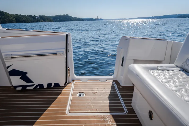 Slide: The Image of Luxury deck view from 2026 Fountain 39 DX boat, overlooking serene water. - 25