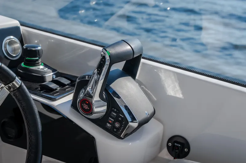 Slide: The Image of Close-up of 2026 Fountain 39 DX boat controls with throttle and joystick. - 30
