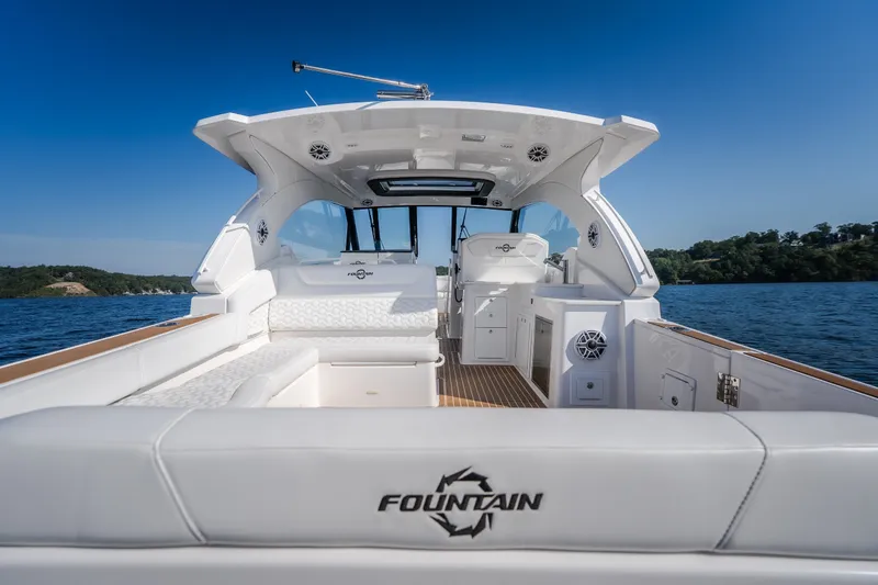 Slide: The Image of Luxury 2026 Fountain 39 DX boat interior on a serene lake. - 16