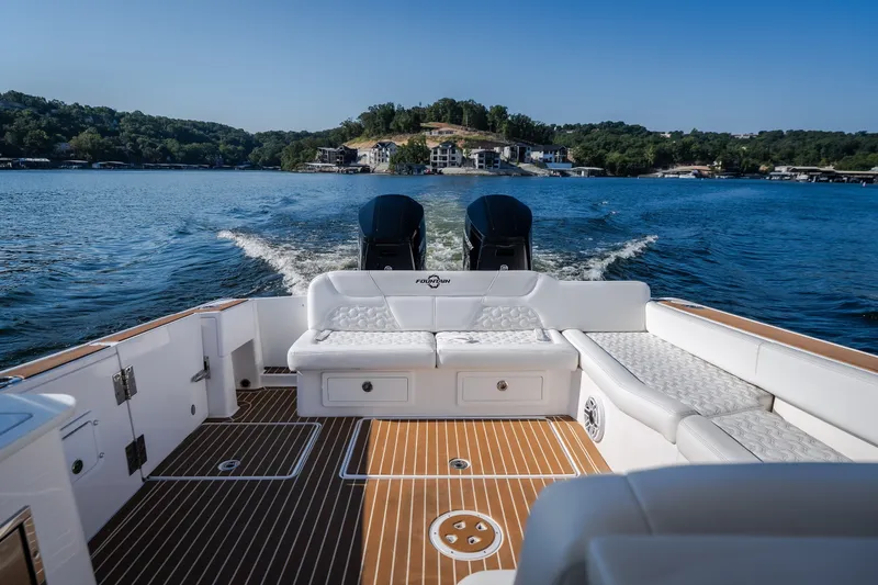 Slide: The Image of Luxury Fountain 39 DX boat cruising on a scenic lake, 2026 model. - 38