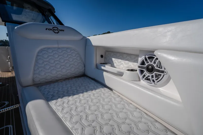 Slide: The Image of Luxurious seating on 2026 Fountain 39 DX boat with speaker and cup holder. - 70