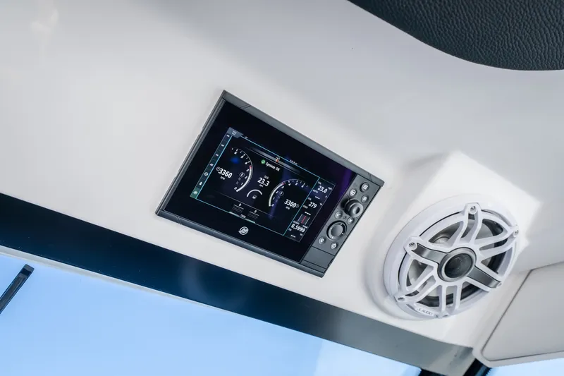 Slide: The Image of 2026 Fountain 39 DX boat dashboard with digital display and speaker system. - 44