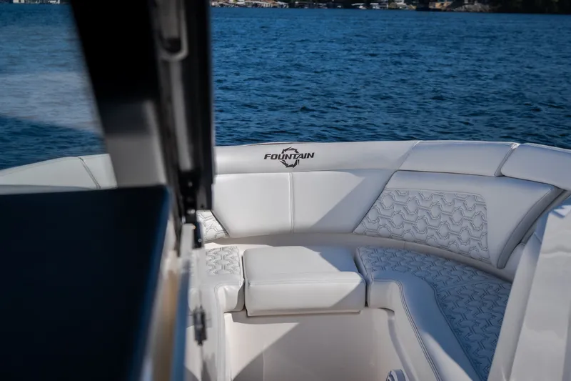 Slide: The Image of Luxurious seating on 2026 Fountain 39 DX boat with scenic water view. - 61