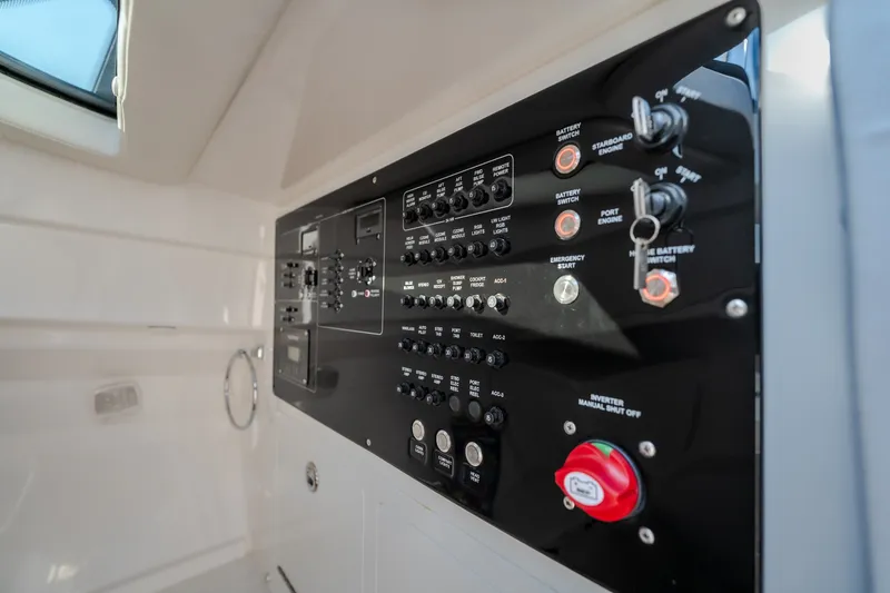 Slide: The Image of Control panel of 2026 Fountain 39 DX boat with switches and indicators. - 78