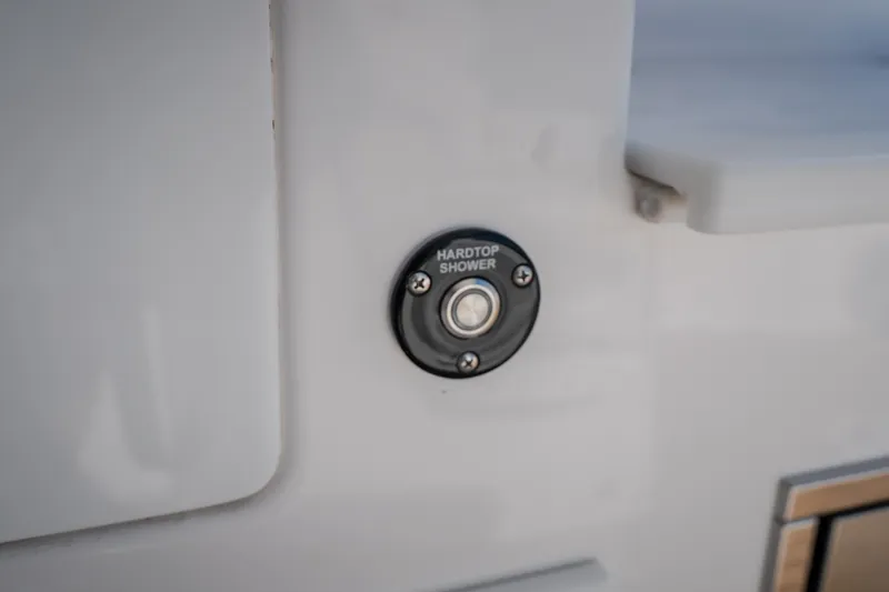 Slide: The Image of Hardtop shower button on 2026 Fountain 39 DX boat interior. - 53