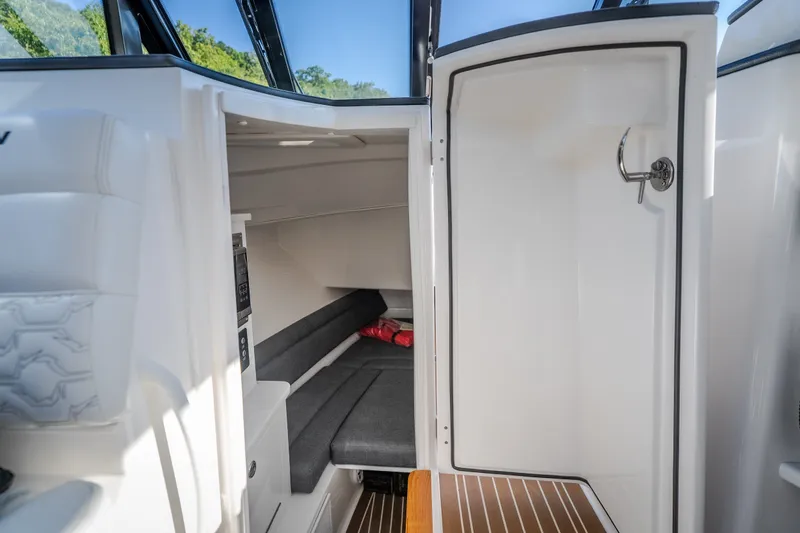 Slide: The Image of Interior cabin of 2026 Fountain 39 DX boat with seating and storage. - 74