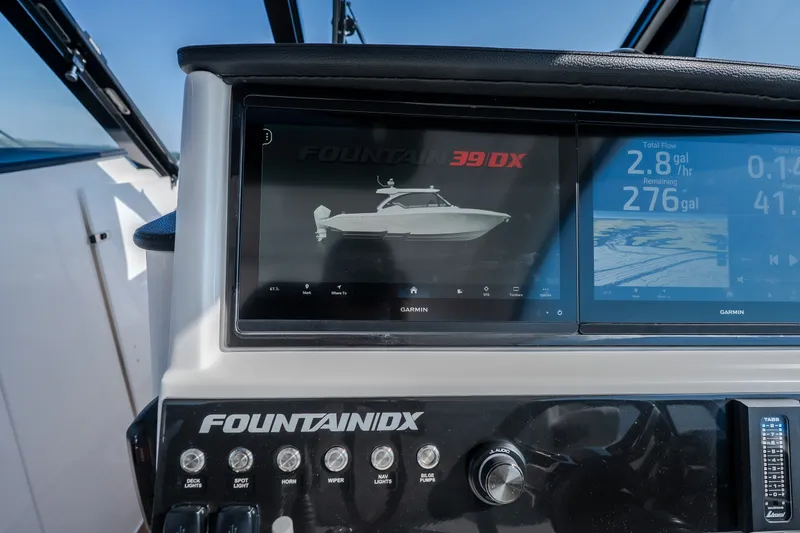 Slide: The Image of Dashboard of 2026 Fountain 39 DX boat with Garmin displays and controls. - 33