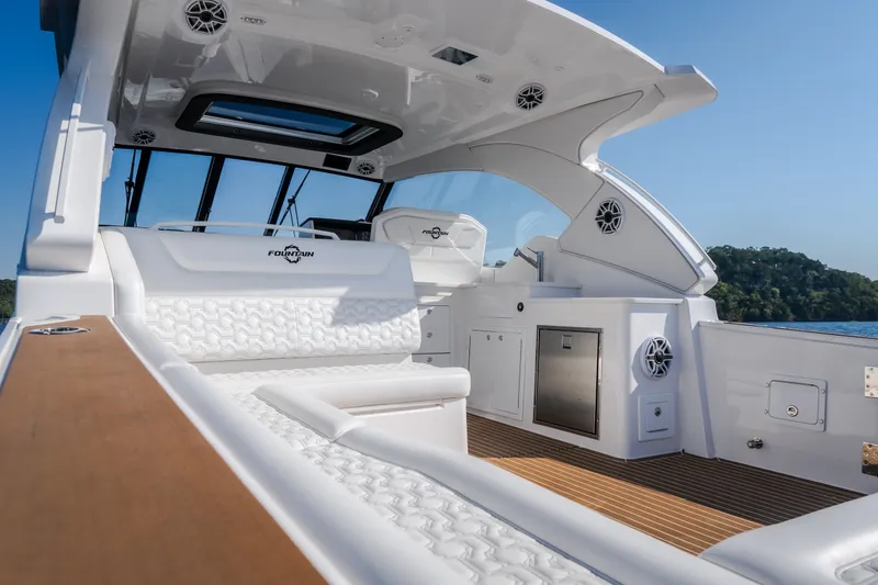 Slide: The Image of Luxurious 2026 Fountain 39 DX boat interior with white seating and modern amenities. - 18