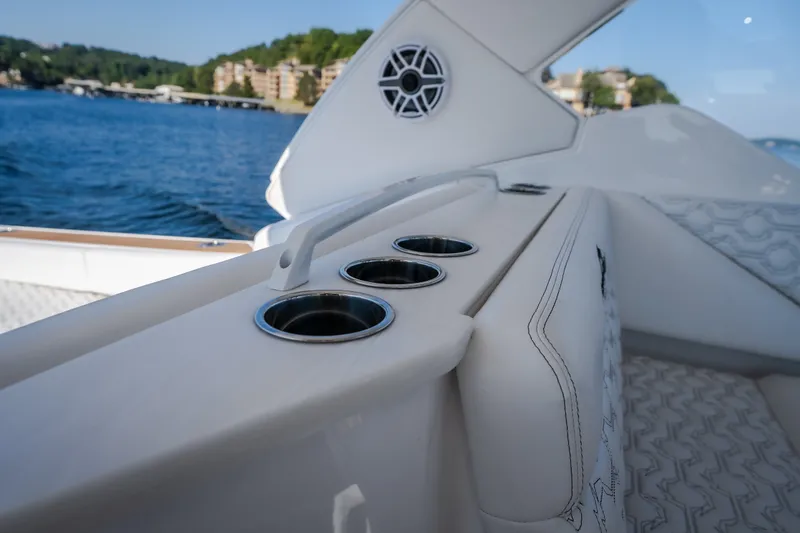 Slide: The Image of Luxury seating on 2026 Fountain 39 DX boat with cup holders and scenic water view. - 39