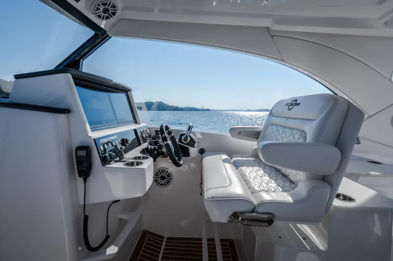 Slide: The Image of Interior of 2026 Fountain 39 DX boat with modern helm and luxurious seating. - 28