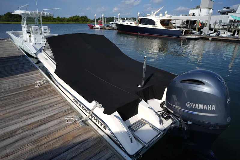 Slide: The Image of 2018 Grady-White Freedom 192 boat docked with Yamaha outboard motor. - 32