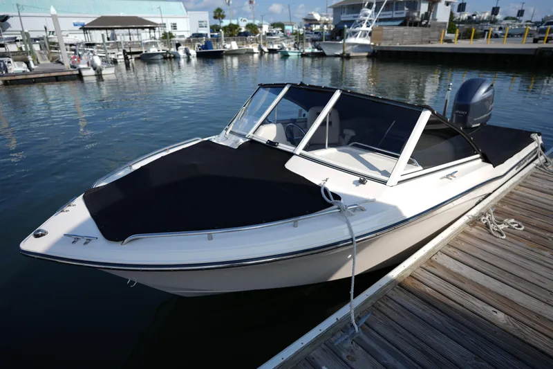 Slide: The Image of 2018 Grady-White Freedom 192 boat docked at marina, covered and ready for use. - 31