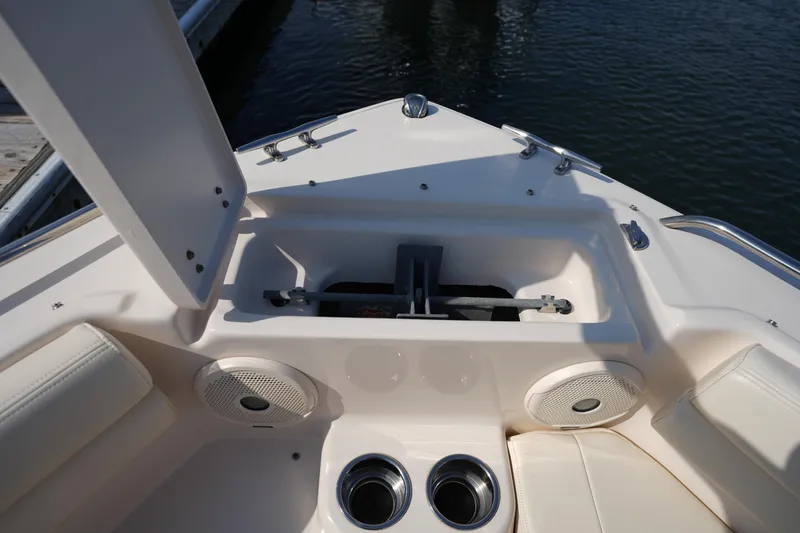 Slide: The Image of 2018 Grady-White Freedom 192 boat interior with storage compartment and speakers. - 30