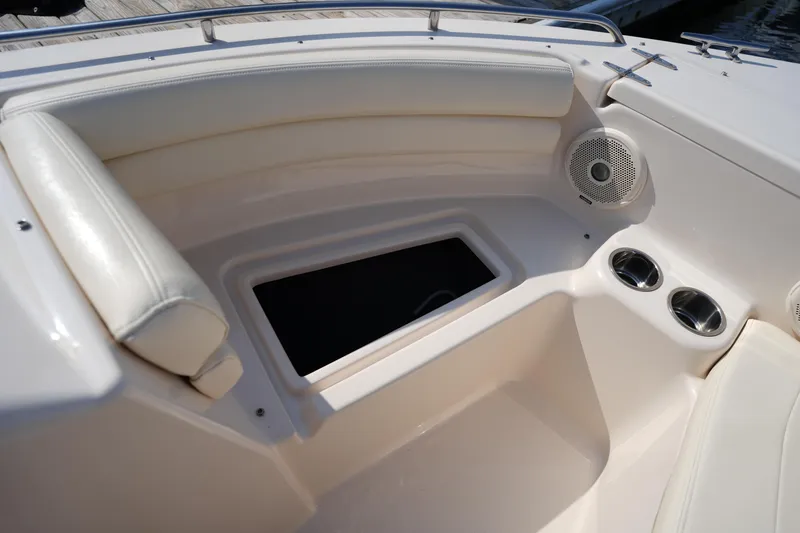 Slide: The Image of 2018 Grady-White Freedom 192 boat interior with seating, speaker, and cup holders. - 29