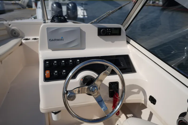 Slide: The Image of 2018 Grady-White Freedom 192 boat dashboard with Garmin navigation system. - 21
