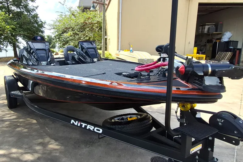 Slide: The Image of 2020 Nitro Z19 Pro boat on trailer, parked outdoors near a building. - 4