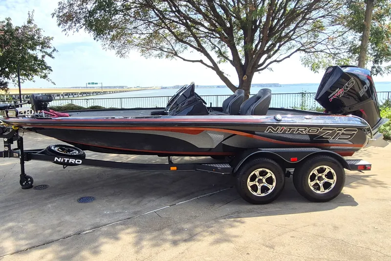 The Image of 2020 Nitro Z19 Pro boat on trailer by waterfront, under tree. - 0
